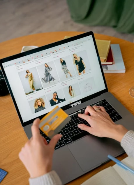 Customer shopping online on an ecommerce website using a laptop