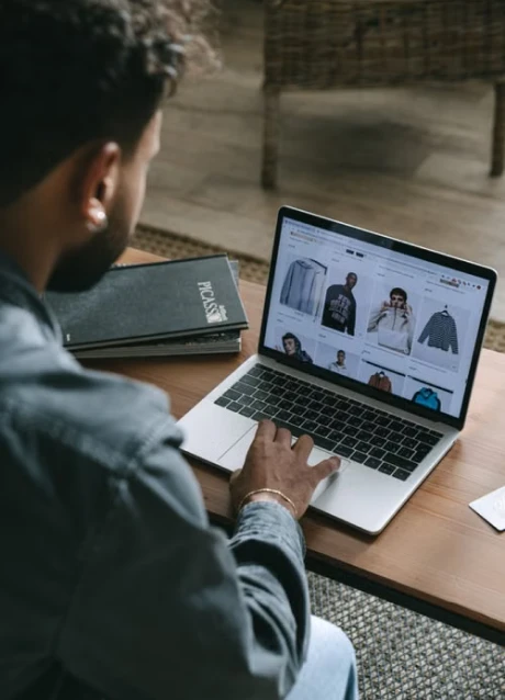 Developer managing an ecommerce website on a laptop