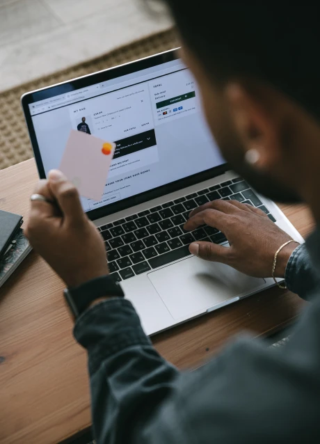 Customer using an online checkout system with a payment card