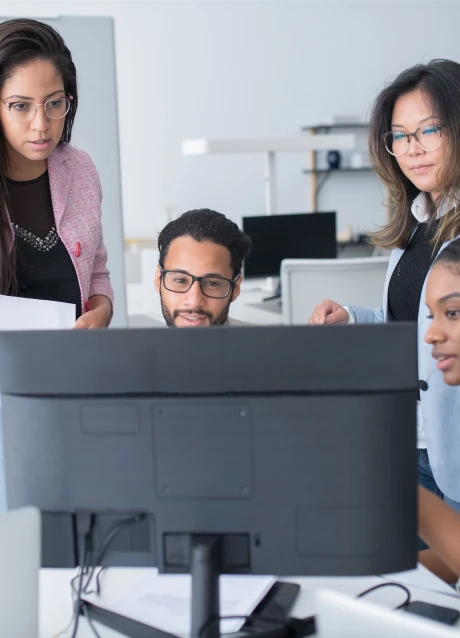 Healthcare team reviewing information together at a computer