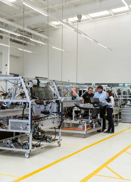 Manufacturing professionals working with connected production systems