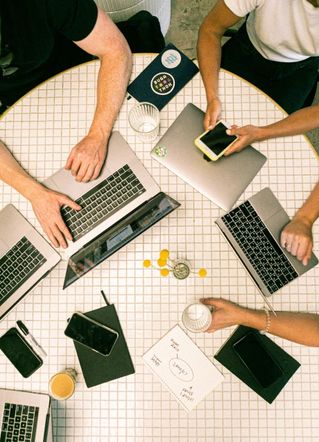 Developer working with code across multiple computer screens