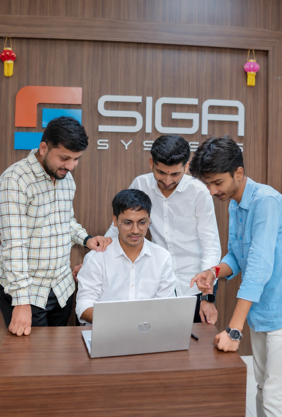 Team members collaborating on a business management system