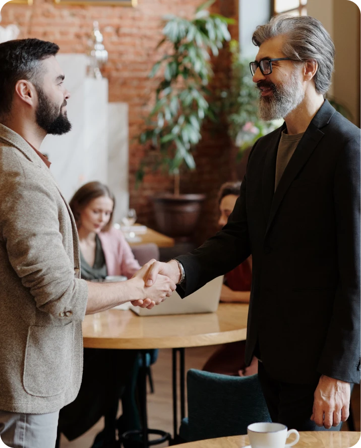 Business professionals shaking hands