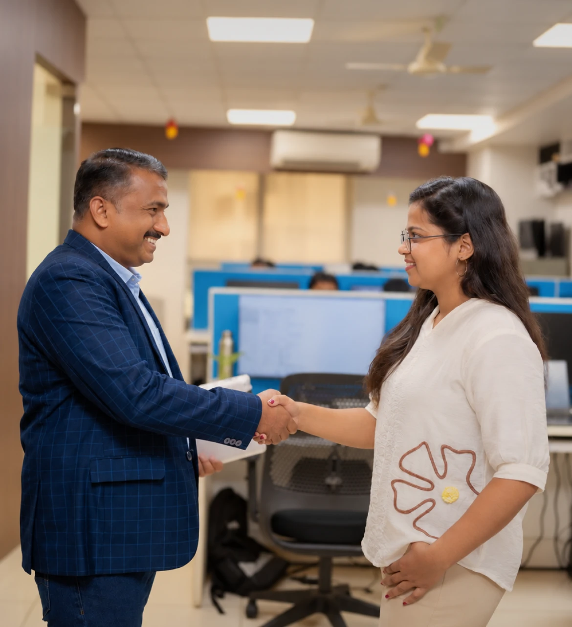 Business professionals shaking hands in an office