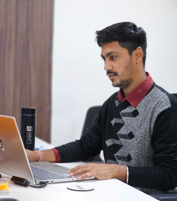 Technology professional working at a computer